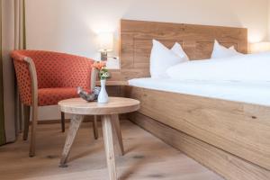 Łóżko lub łóżka w pokoju w obiekcie Hotel Untersberg