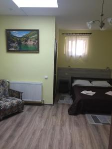 Postel nebo postele na pokoji v ubytování Hotel Karpaty