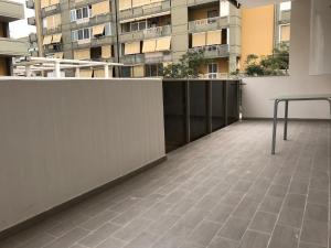a balcony with a table and a building at Bari Lory’s Home in Bari