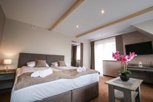 Posteľ alebo postele v izbe v ubytovaní Ania Apartamenty