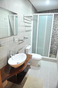 a bathroom with a sink and a toilet at Casa da Tapada - Grupo Casas Vale do Lima in Ponte de Lima
