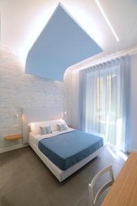Posteľ alebo postele v izbe v ubytovaní In Centro B&B