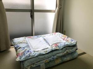 Postel nebo postele na pokoji v ubytování Hotel Mirai