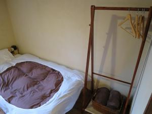 Postel nebo postele na pokoji v ubytování Guest house Roji to Akari
