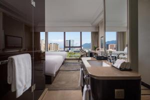 Ένα ή περισσότερα κρεβάτια σε δωμάτιο στο Kasion International Hotel Yiwu