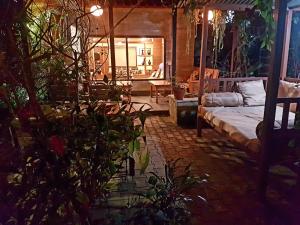 a living room with a bed and a couch at Hotel Middle Path & Spa in Pokhara