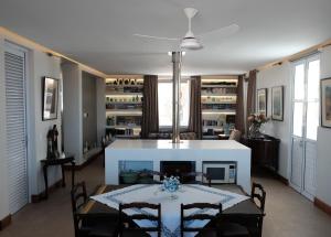 a dining room and living room with a table and chairs at Nieuwerust in Prince Albert