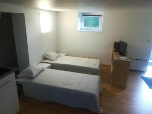 Postel nebo postele na pokoji v ubytování Le willou