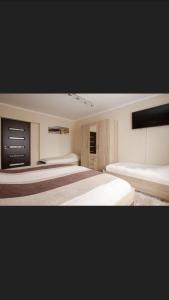 Ένα ή περισσότερα κρεβάτια σε δωμάτιο στο Juhar Wellness vendégház