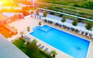 an overhead view of a pool at a hotel at Ramada Plaza by Wyndham Gevgelija in Gevgelija