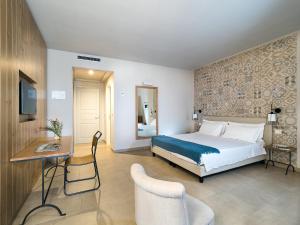 A bed or beds in a room at Rocca dei Saraceni