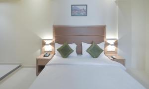 Postel nebo postele na pokoji v ubytování Hotel West Blue