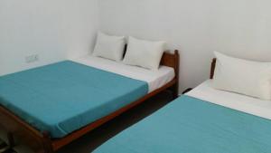 Postel nebo postele na pokoji v ubytování Tea Breeze Motel