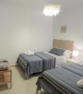 Postel nebo postele na pokoji v ubytování Paseos por Córdoba