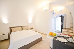 Posteľ alebo postele v izbe v ubytovaní Scirocco Apartment with terrace by Wonderful Italy