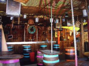 a bar with a bunch of barrels in a room at Naturist Paradise in « Swinging Cap » in Cap d'Agde
