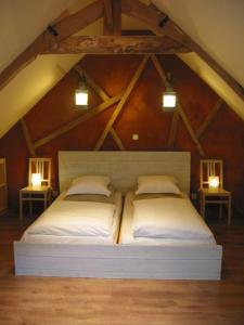 a bedroom with two beds in a attic at Arrest-en-Baie in Arrest