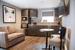 a living room with a couch and a table at EPIC Apart Hotel, Duke Street, Central Liverpool Apartments Near Liverpool ONE in Liverpool