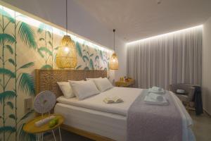 Postel nebo postele na pokoji v ubytování Harma Boutique Hotel