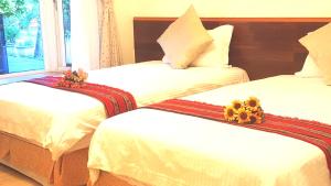 Voodi või voodid majutusasutuse Yishin Garden B&B toas