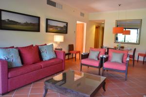 a living room with a couch and two chairs and a table at Golf F5 by Garvetur in Vilamoura