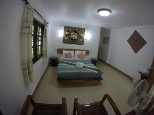 Krevet ili kreveti u jedinici u objektu Khao Sok Holiday Resort
