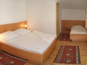 Postel nebo postele na pokoji v ubytování Appartements Hirner