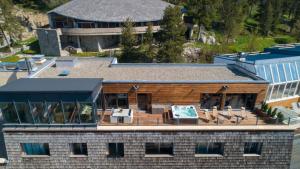 an aerial view of a house with a deck at level mountain in Font-Romeu