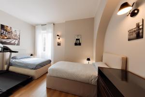 Posteľ alebo postele v izbe v ubytovaní Milano Manzoni CLC Apartments