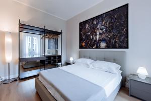 Posteľ alebo postele v izbe v ubytovaní Milano Manzoni CLC Apartments
