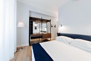 Posteľ alebo postele v izbe v ubytovaní Milano Manzoni CLC Apartments