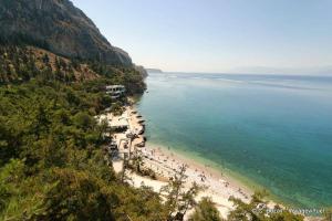 a group of people on a beach near the water at Sea voyage in Nafplio