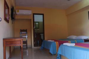 Postel nebo postele na pokoji v ubytování Hotel Progreso + 4 fotografie