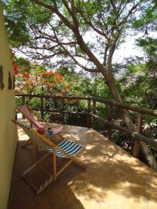 a deck with a chair and a tree at Finca Los Dioses I in Mogán