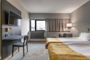 Voodi või voodid majutusasutuse Quality Hotel Royal Corner toas