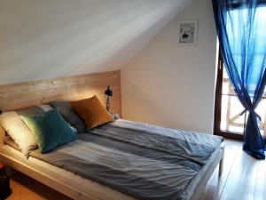 Postel nebo postele na pokoji v ubytování Kubiczówka