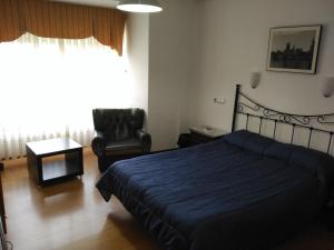 Postel nebo postele na pokoji v ubytování Hotel Vaqueros