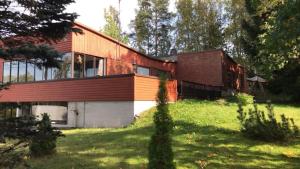 a house with a garage and a building at Villa Campari in Imatra