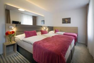 Krevet ili kreveti u jedinici u okviru objekta Hotel White Lion