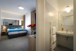 Krevet ili kreveti u jedinici u okviru objekta Hotel White Lion