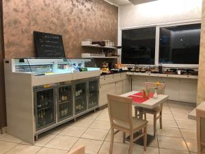 Kuchyňa alebo kuchynka v ubytovaní Hotel Nuova Orchidea