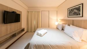 Rúm í herbergi á Asuncion Rent Suites Centro