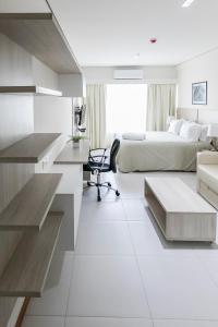 Rúm í herbergi á Asuncion Rent Suites Centro