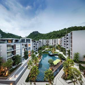 an aerial view of an apartment complex with a swimming pool at The Valley Khaoyai Tropical Style in Ban Huai Sok Noi