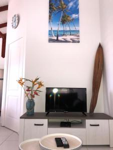 TV a/nebo společenská místnost v ubytování Tigili l'Appart Lagon