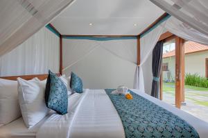 Postel nebo postele na pokoji v ubytování Amore Villas