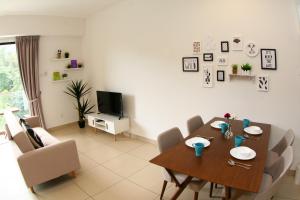 a dining room with a table and chairs at RELAX & COZY HOME @ MIDHILLS GENTING in Genting Highlands