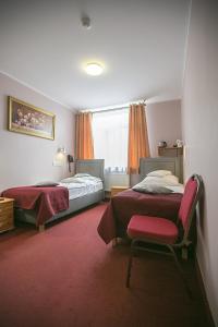 Ένα ή περισσότερα κρεβάτια σε δωμάτιο στο Hotel Unibus