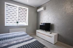 Televízia a/alebo spoločenská miestnosť v ubytovaní Apartment in center premium
