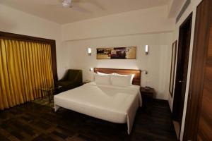 Voodi või voodid majutusasutuse Lemon Tree Hotel Coimbatore toas